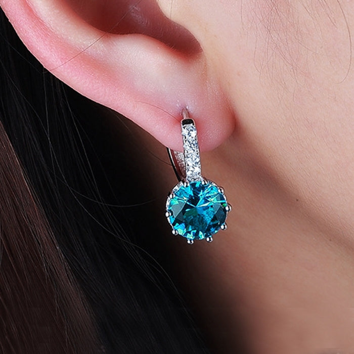 925 sterling silver hoop earrings with bright blue round zircon stone close-up