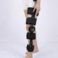 Black knee brace with rigid straps and circular tension dial on the side