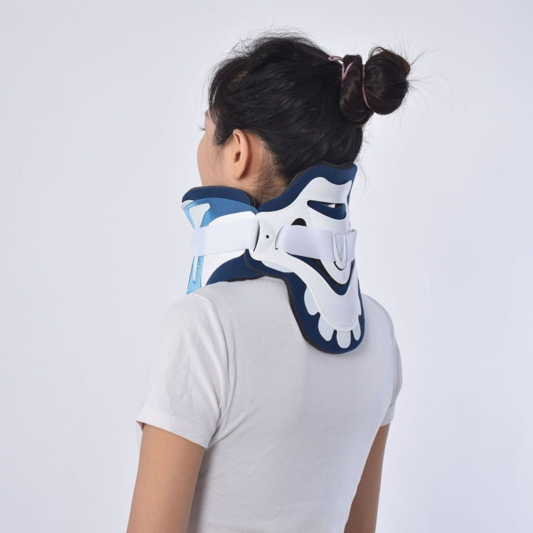 Back view of plastic neck brace on head and neck; navy and white with light-blue trim