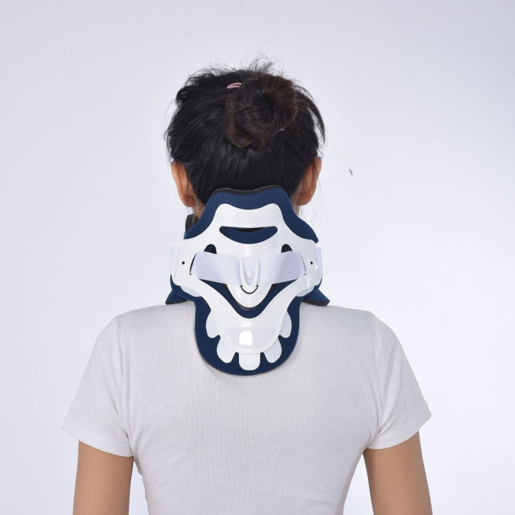 Rear view of plastic neck brace with navy and white outer shell and light-blue padding