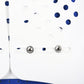 Close-up of thoracolumbar brace snaps on white panel with blue dot pattern