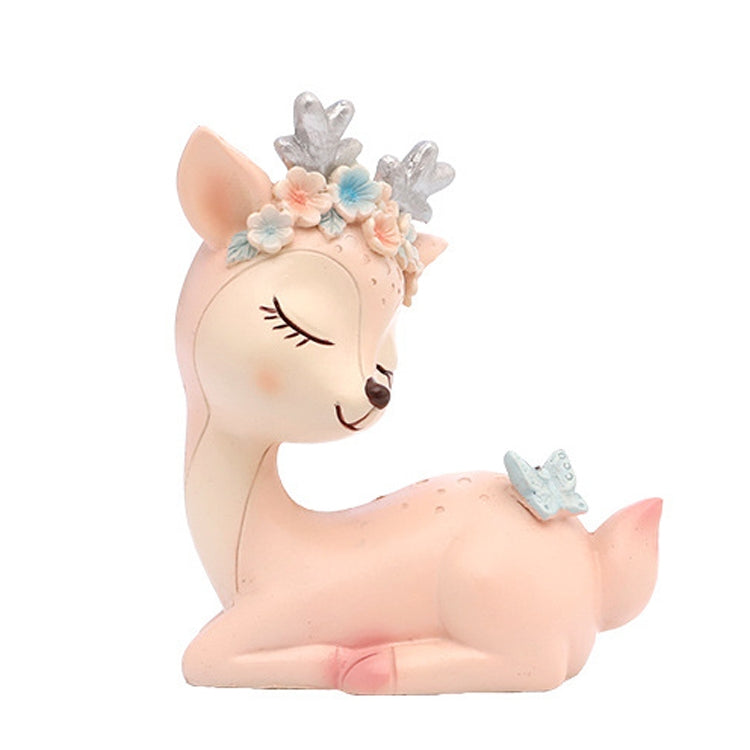 Pink cartoon deer resin decoration, lying down with flower crown and blue butterfly detail