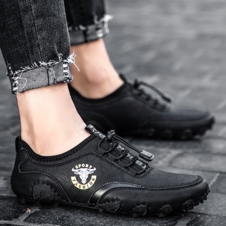 Black leather casual sneakers with adjustable strap and chunky tread sole