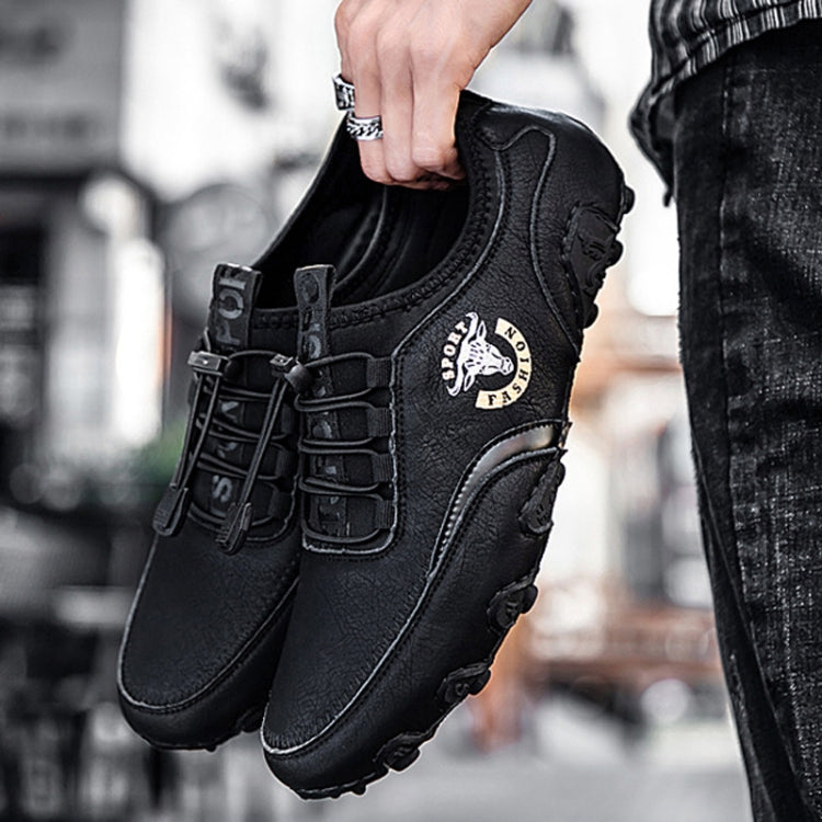 Black leather lace-up sneakers with side logo and chunky rubber tread sole