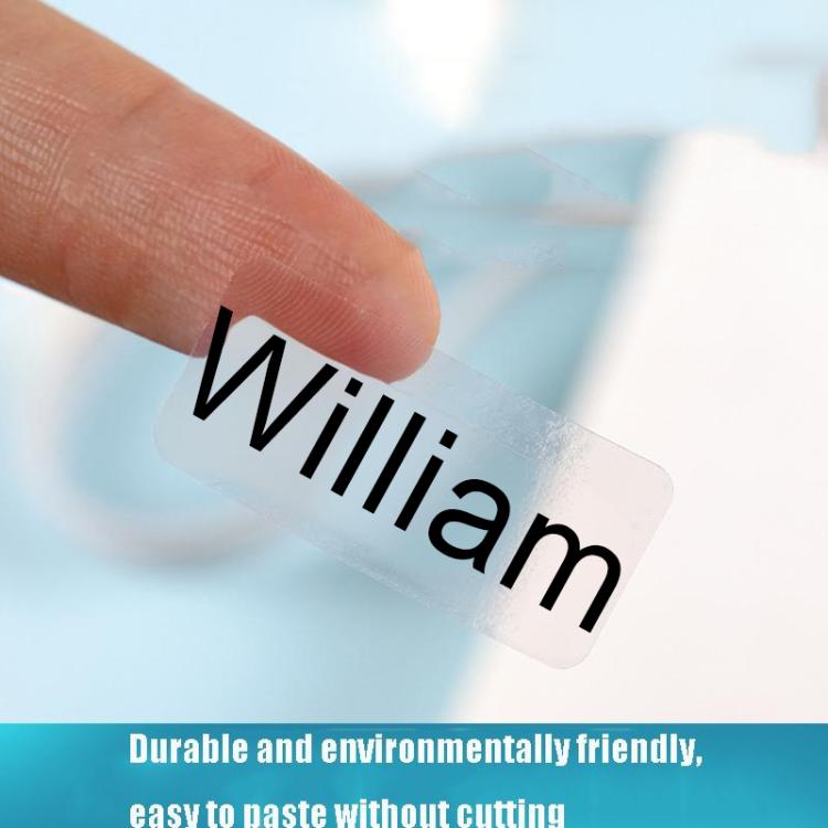 Transparent label sticker with bold printed name, being applied by a finger