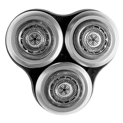 Three circular silver razor heads with black frame, close-up detail