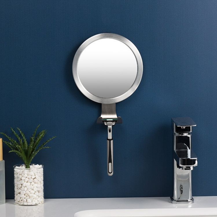 Round bathroom mirror with suction handle and wall-mounted stand