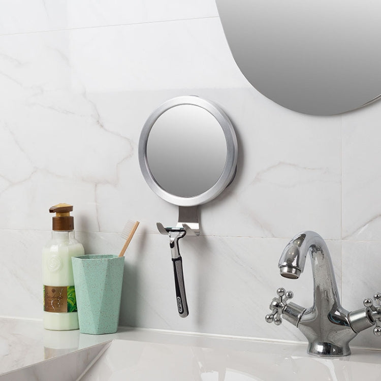 Round anti-fog bathroom mirror with suction stand and handle near sink