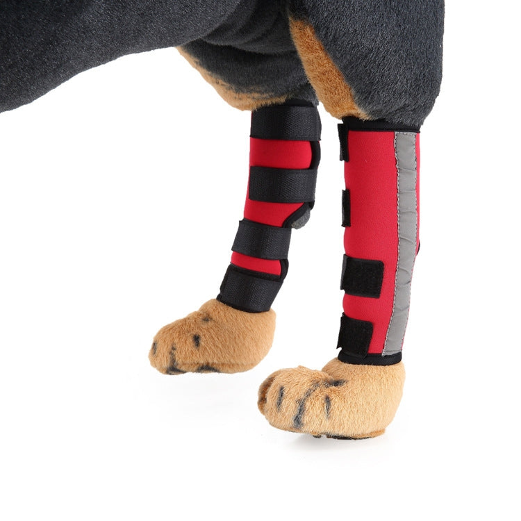 Dog knee pads in red with black straps and gray trim panel