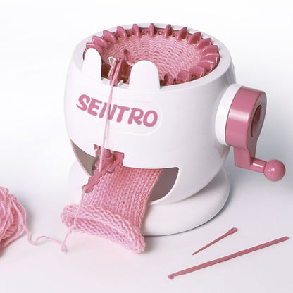 Pink and white knitting loom toy machine with yarn and knitting tool accessories
