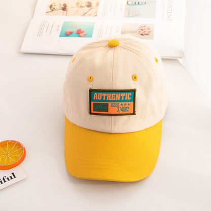Kids baseball cap with beige crown, yellow brim, and “AUTHENTIC” front patch