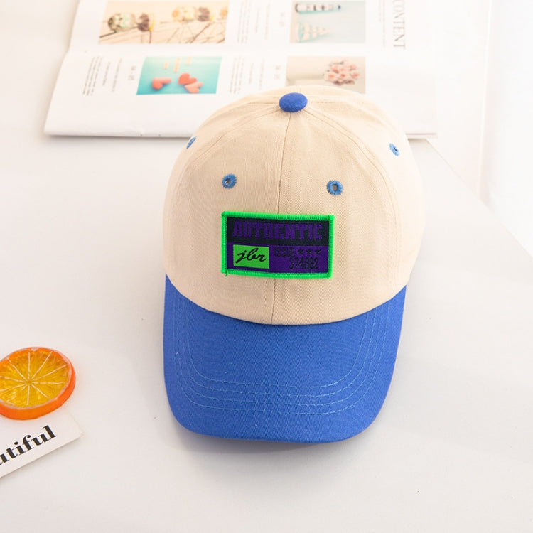 Kids baseball cap with beige crown, blue brim, and “AUTHENTIC” front patch