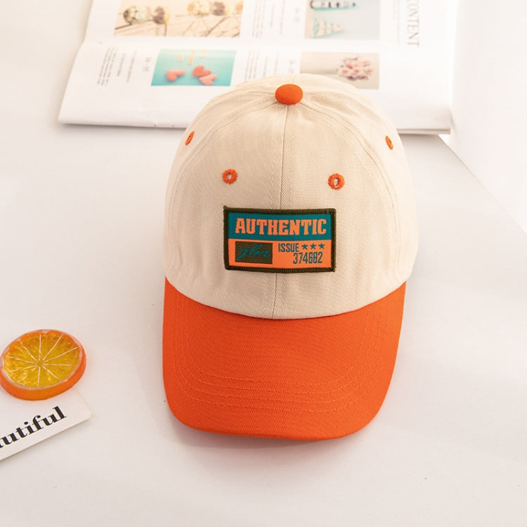 Kids baseball cap with beige crown, orange brim, and “AUTHENTIC” front patch