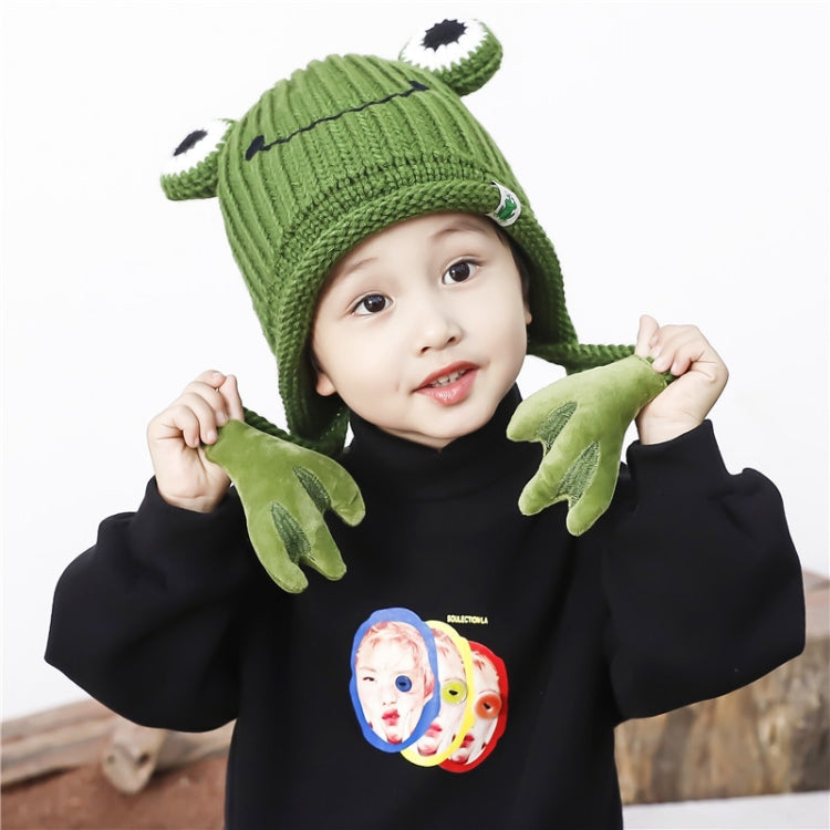 Green frog knit hat with top eye detail and plush hand-like ear flaps