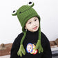 Green frog knit hat with top eye patches and dangling plush ear flaps