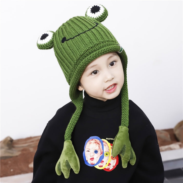 Green frog knit hat with top eye patches and dangling plush ear flaps