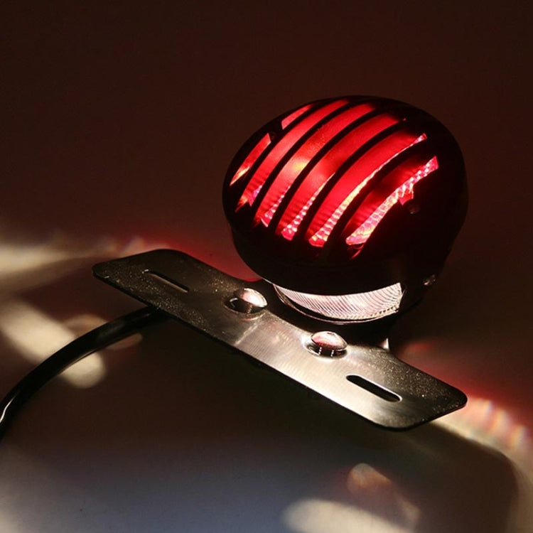 Illuminated black tail light with vivid red LED stripes on rear mounting plate
