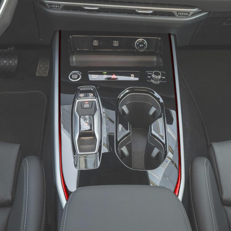 Red carbon-fiber gear shift side trim sticker strips on center console edges.