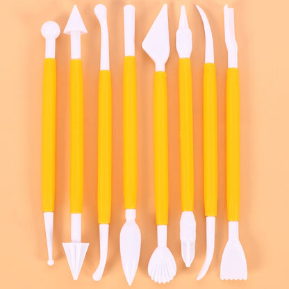 Yellow fondant carving pen and cutter tool set with white tips, assorted shapes