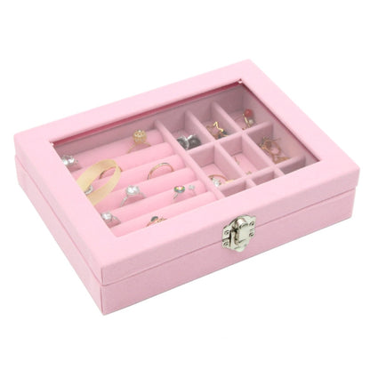 Pink flannel jewelry storage box with hinged lid and divided grid compartments, open view