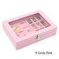 Pink flannel jewelry box with hinged lid and grid compartments for rings and earrings, open