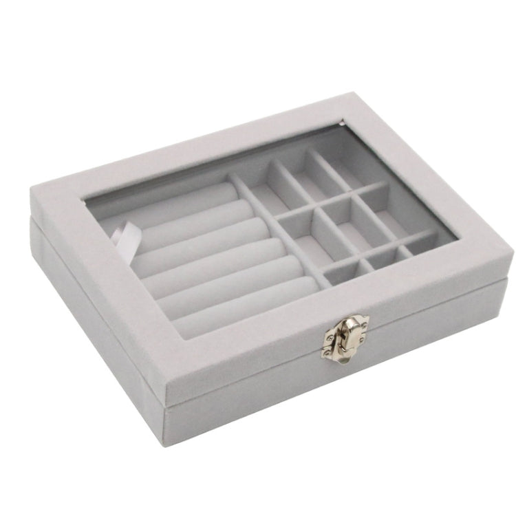 Gray flannel jewelry storage box with hinged lid and divided grid compartments, open view