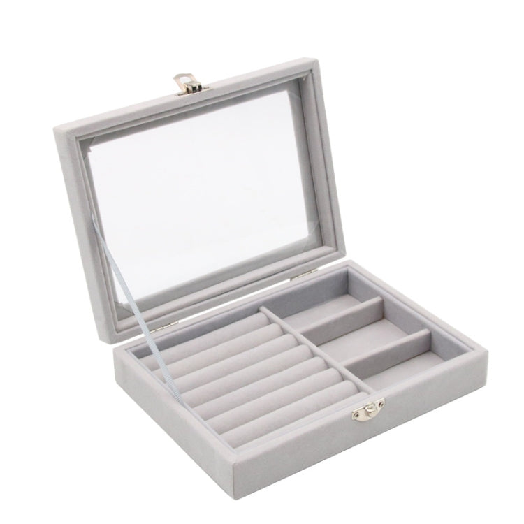 Gray flannel jewelry box with hinged lid open, showing ring slots and section dividers