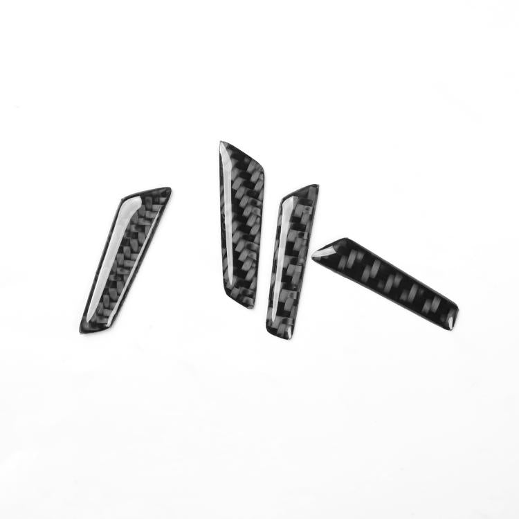 Four black carbon-fiber style trim pieces with windowed inserts, set for door panel