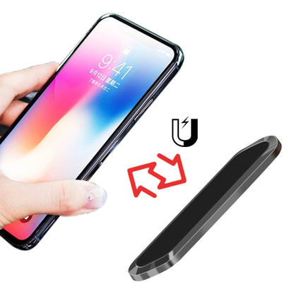 Magnetic phone car bracket, black rounded metal strip; hand holds phone in place