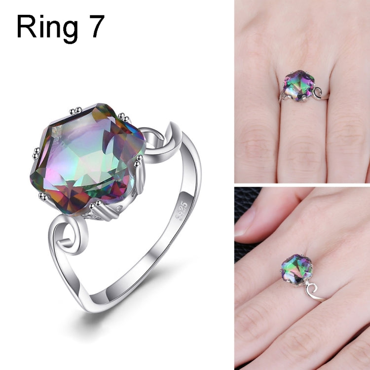 Sterling silver ring with large multicolor faceted gemstone and twisted band accents