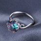 Sterling silver ring with multicolor faceted round-rectangular gemstone and circular band loop detail