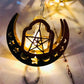 Crescent and star lantern LED light with warm white glow on the string.