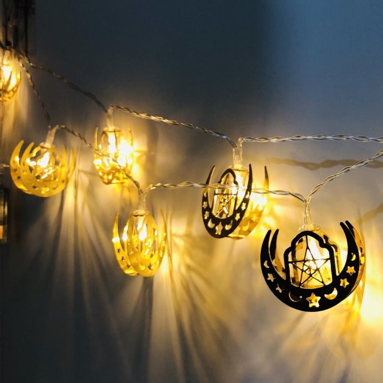 Eid LED string lights with crescent lantern cutouts; warm white glow along the line.