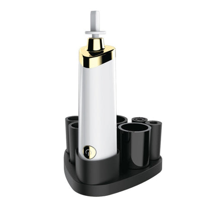 White electric makeup brush scrubber with gold cap and upright cleaning head on base