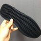 Black rubber outsole with deep tread pattern