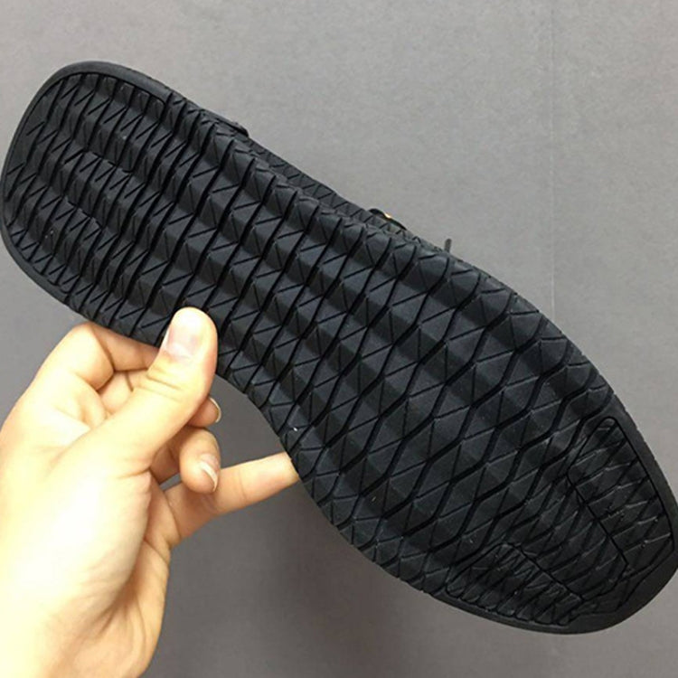 Black rubber outsole with deep tread pattern