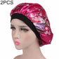 Women’s satin hair bonnet in magenta with floral print and black elastic band