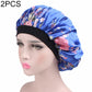 Women’s satin hair bonnet in blue floral print with gathered top and black elastic band