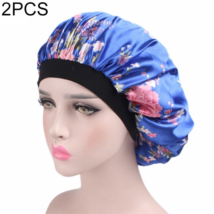 Women’s satin hair bonnet in blue floral print with gathered top and black elastic band