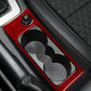 Red carbon-fiber cup holder trim insert with dual openings and knob recess