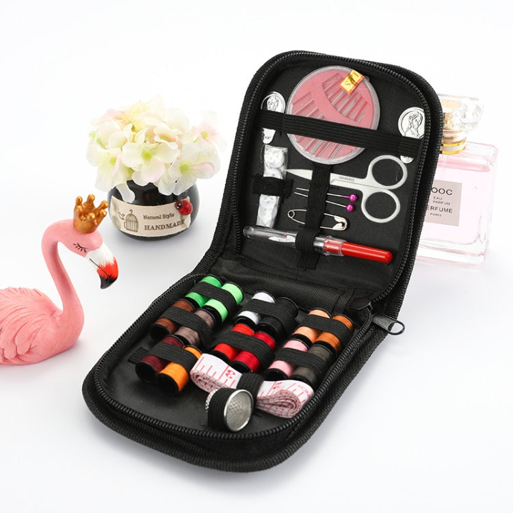 Black portable sewing kit case with thread, scissors, needles, and sewing accessories inside