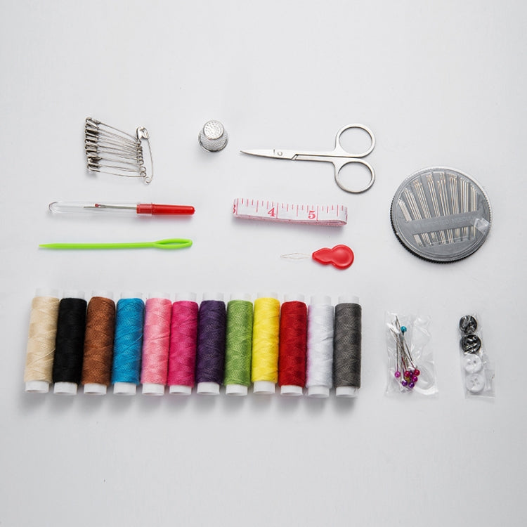 Sewing accessories assortment: thread spools, measuring tape, scissors, pins, and needle tools