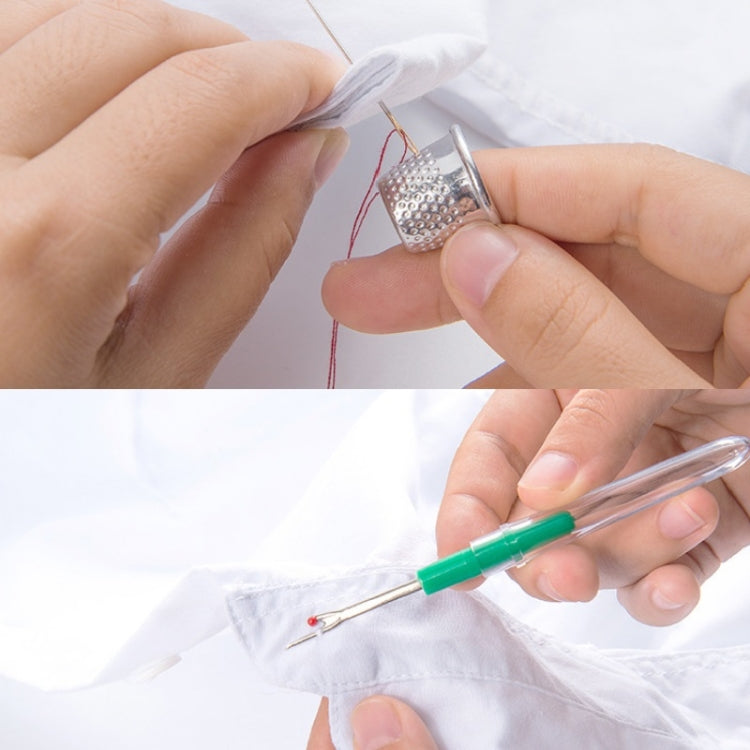 Hands using a needle threader and sewing needle on white fabric