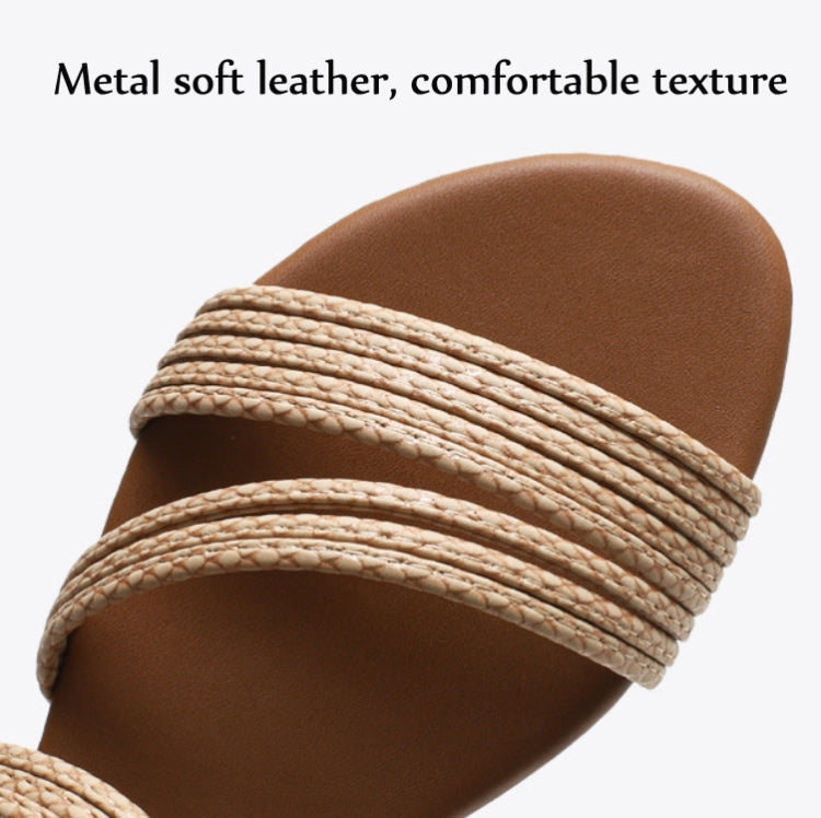 Close-up of apricot sandal straps with ribbed texture across the open toe