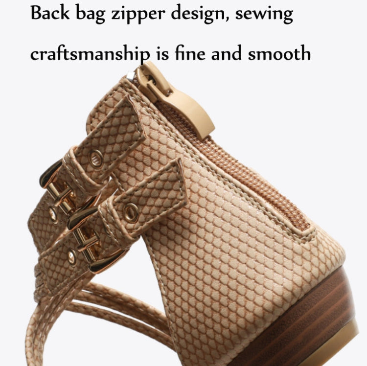 Close-up of apricot ankle strap with metal buckle and textured upper
