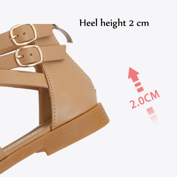 Tan low-heeled sandal with buckled ankle straps and 2 cm heel