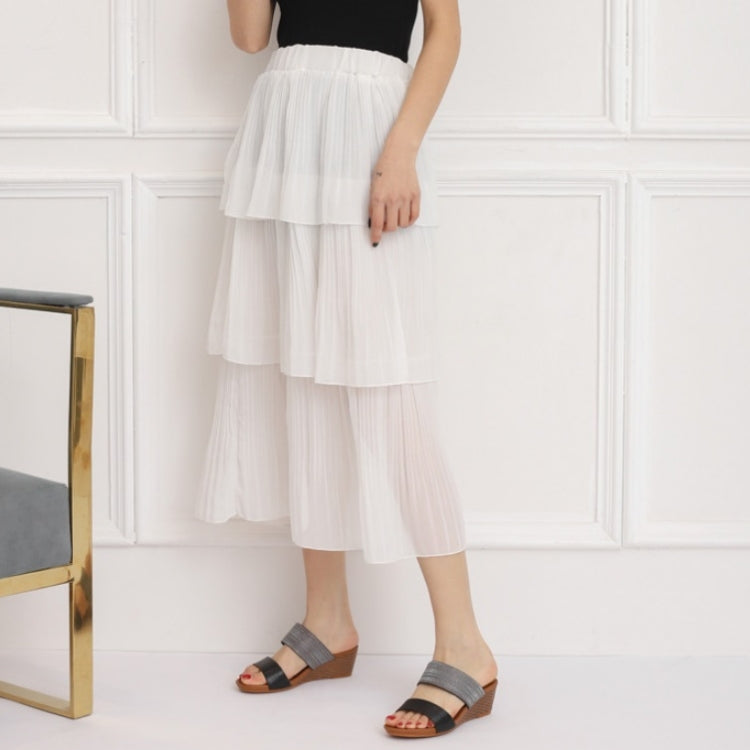 Two-strap platform wedge sandals with dark grey straps worn with layered white skirt