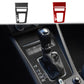 Carbon-fiber gear shift panel trim stickers, black and red accents, on center console.