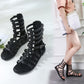 Black open-toe ankle sandals with flat sole and buckled multi-strap cage upper