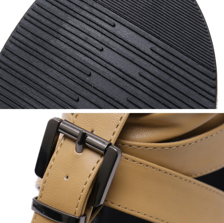Rubber outsole tread of light brown sandals with buckle strap, black textured grip
